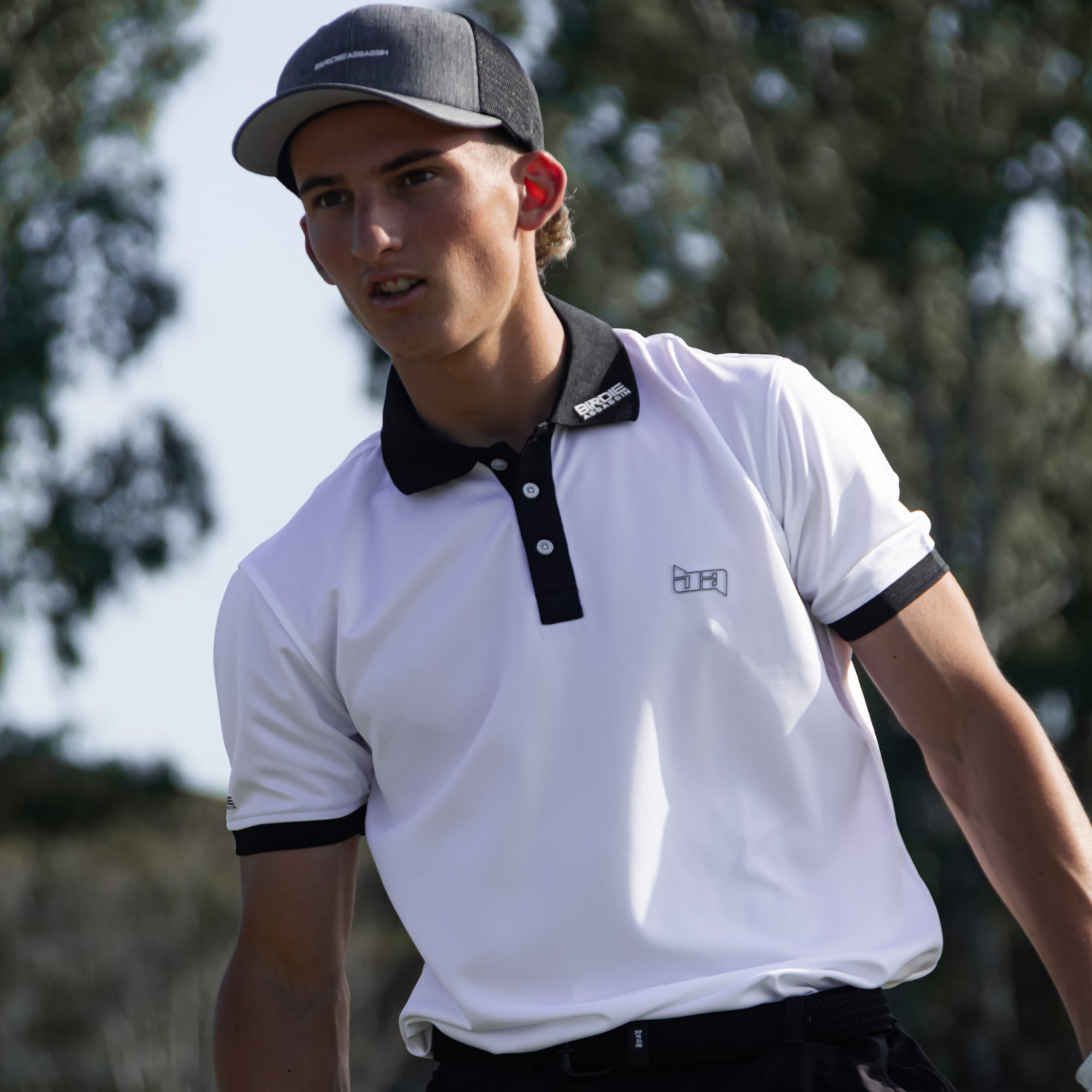 Person wearing a Iceman golf polo shirt looking down the fairway